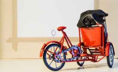 red color metal tricycle toy pedicab closeup