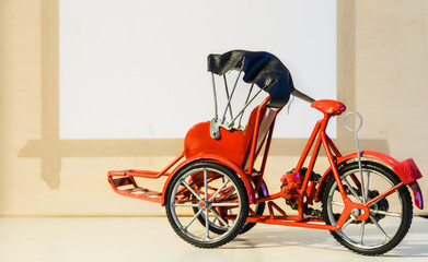red color metal tricycle toy pedicab closeup