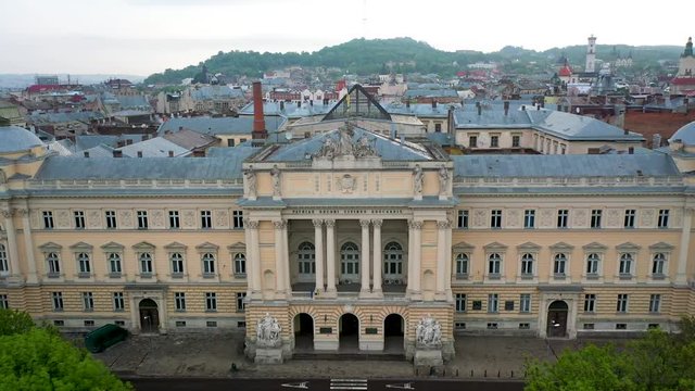 Flying near Ivan Franko National University of Lviv in rainy weather with clouds