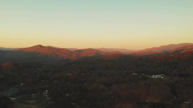 Landscape Solar Flare Sunrise over Tennessee Mountains Cherokee Town in Valley Slow Motion Drone Shot