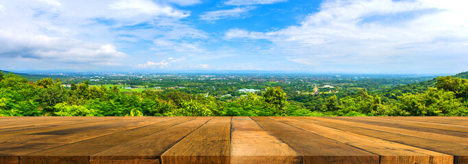 Wood table with  city in background.