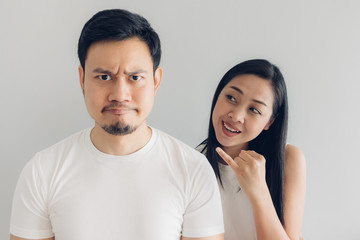 Sulk and reconcile couple lover in white t-shirt and grey background.