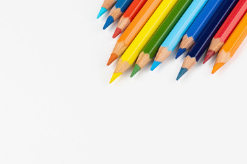 Set of colored pencils. Colors of rainbow. Colored pencils for drawing different colors on a white background.