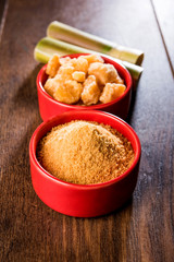 Organic Gur or Jggery Powder is unrefined sugar obtained from concentrated sugarcane juice. served in a bowl. selective focus