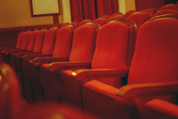 Obraz premium Old cinema/theatre. Empty seats in theater. Film industry, art, audience love concept.