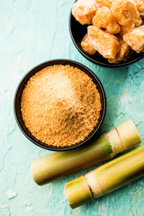 Organic Gur or Jggery Powder is unrefined sugar obtained from concentrated sugarcane juice. served in a bowl. selective focus