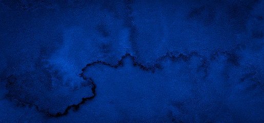 Fototapeta na wymiar Dark rich blue watercolor background with torn strokes and uneven divorces. Abstract background for design, layouts and patterns.