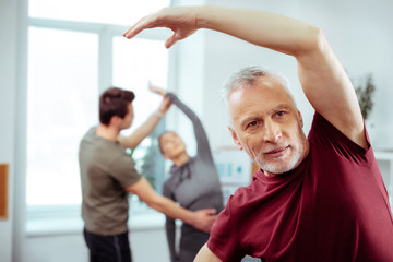 Handsome mature man trying to be fit