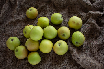 Ripe apples on burlap