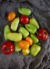 Green pepper and yellow and red tomato
