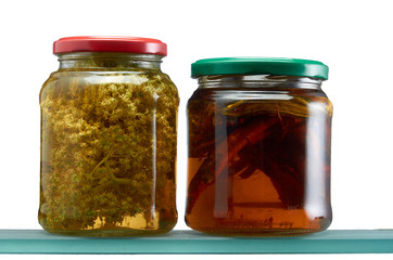 Glass jars with various tinctures in isolate