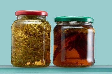 Glass jars with various tinctures in isolate