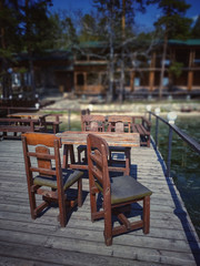 Wood chairs and table on the floating bridge