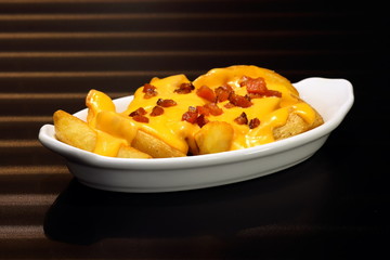 french fries with cheedar sauce and bacon