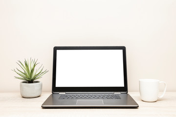 Fototapeta premium Laptop with blank screen on desk, home office background, screen replacement, working from home, wooden table background