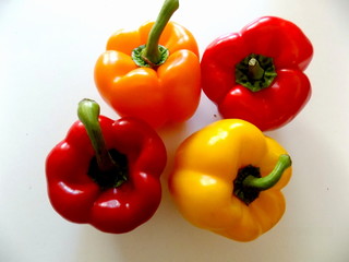 colorful bell peppers isolated on white background
