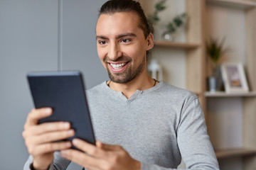 Smiling male making video call