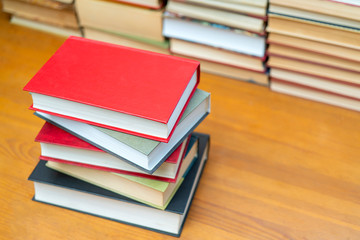 Stack of books in the library. Symbol of knowledge and learning.