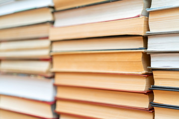 Rows of books in the library. Background for text. Symbol of knowledge and learning.
