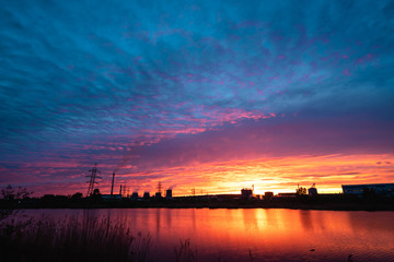 Fototapeta na wymiar Thermal power plant at sunset
