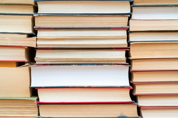 Rows of books in the library. Background for text. Symbol of knowledge and learning.
