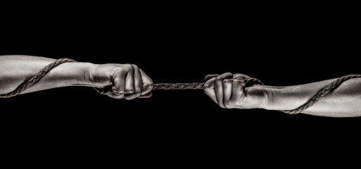 Hand holding a rope, climbing rope, strength and determination. Rescue, help, helping gesture or hands. Conflict, tug of war. Two hands, helping hand, arm, friendship. Rope, cord. - obrazy, fototapety, plakaty