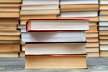 Stack of books in the library. Symbol of knowledge and learning.