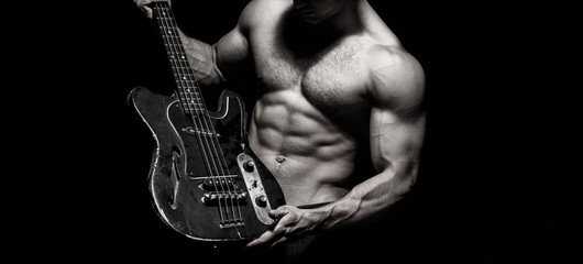 Chest muscles, Six pack, ab, triceps. Music festival. Instrument on stage and band. Strong,...