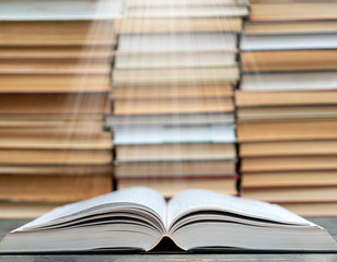 Book pages emit light. Symbol of wisdom, knowledge and learning.