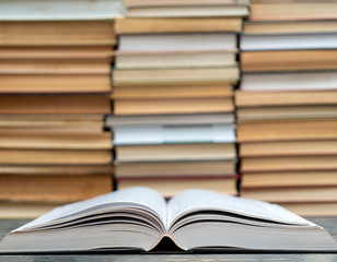 Opened thick book. Symbol of wisdom, knowledge and learning.