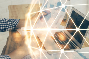 Media network theme hologram with man working on computer on background. Concept of internet communication. Double exposure.