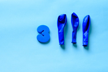 33 celebrating blue number 3 with  three balloons. Thirty three Modern alphabet digits on blue background. 33th birthday party anniversary card.