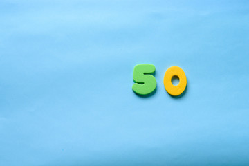 50 years old celebrating classic logo. Colored happy anniversary 50 th template yellow green numbers. Greetings celebrates card. Traditional framed digits of ages.