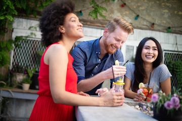 Multiracial group of friends having fun and talking