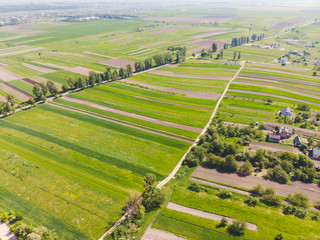 Fototapeta na wymiar aerial view of fields with village near it