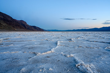 Obraz premium Death Valley, California / USA - May 24, 2019: Badwater Baseline in Death Valley California. Salt landscape in a National Park.