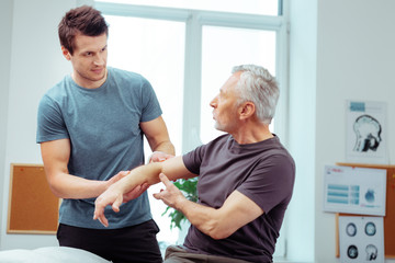 Handsome young man listening to his patient