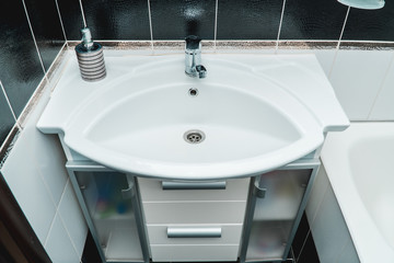 The photo of a sink in a bathroom