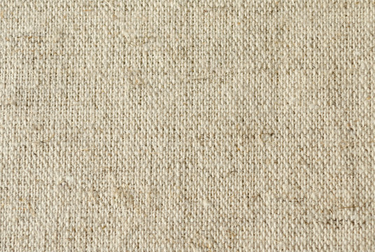 background of coarse linen with a texture of threads and weaves