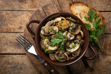fried champignon mushrooms with gurlic and parsley