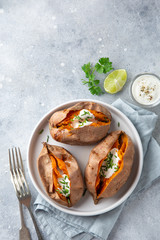baked sweet potato with yogurt sause and chives