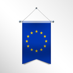 The national flag of the EUROPEAN UNION with textile texture. Triangle flag hanging on a pole. Vertical icon flag for background, banner, web site, logo. Official sign of the countries of the EC.