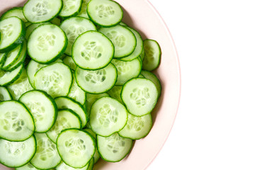 cut cucumbers isolated on white