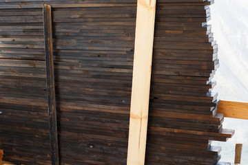 the boards are stacked in the garden