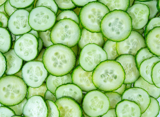 cut cucumbers isolated on white