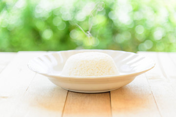 rice cooked in a dish on wood plate