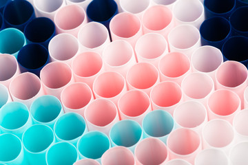 Abstract colorful background. Background from cocktail tubes close up. Soft focus. Cocktail tubes of different colors close up.Close-up of straw tubes.