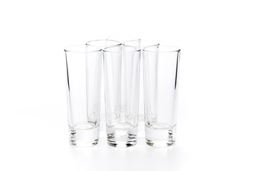  small empty glasses on a white background