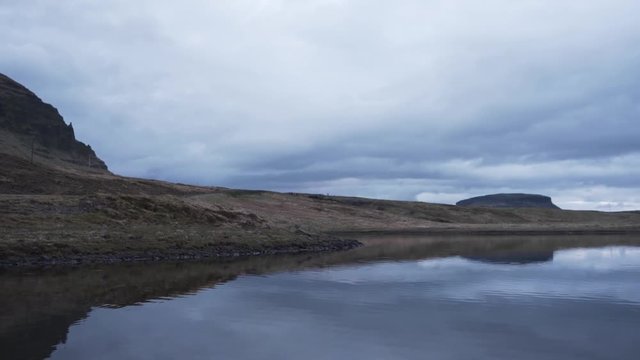 Tilting and panning footage going from left to right of the known mountain called Kirkjufell in Iceland. Filmed at the evening