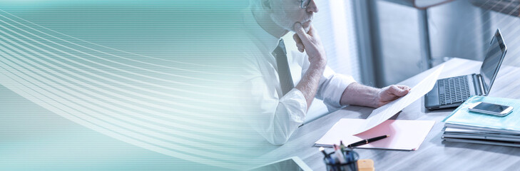 Businessman checking a document; panoramic banner